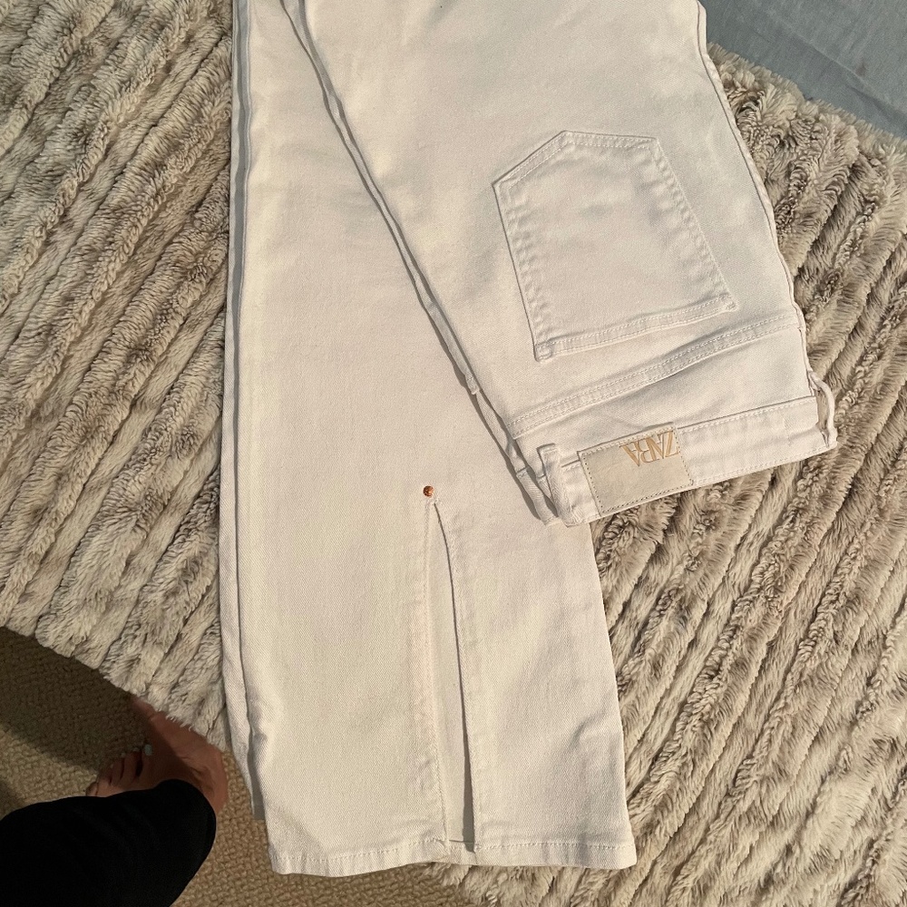 White flare Zara jeans, split detail with copper rivet in back